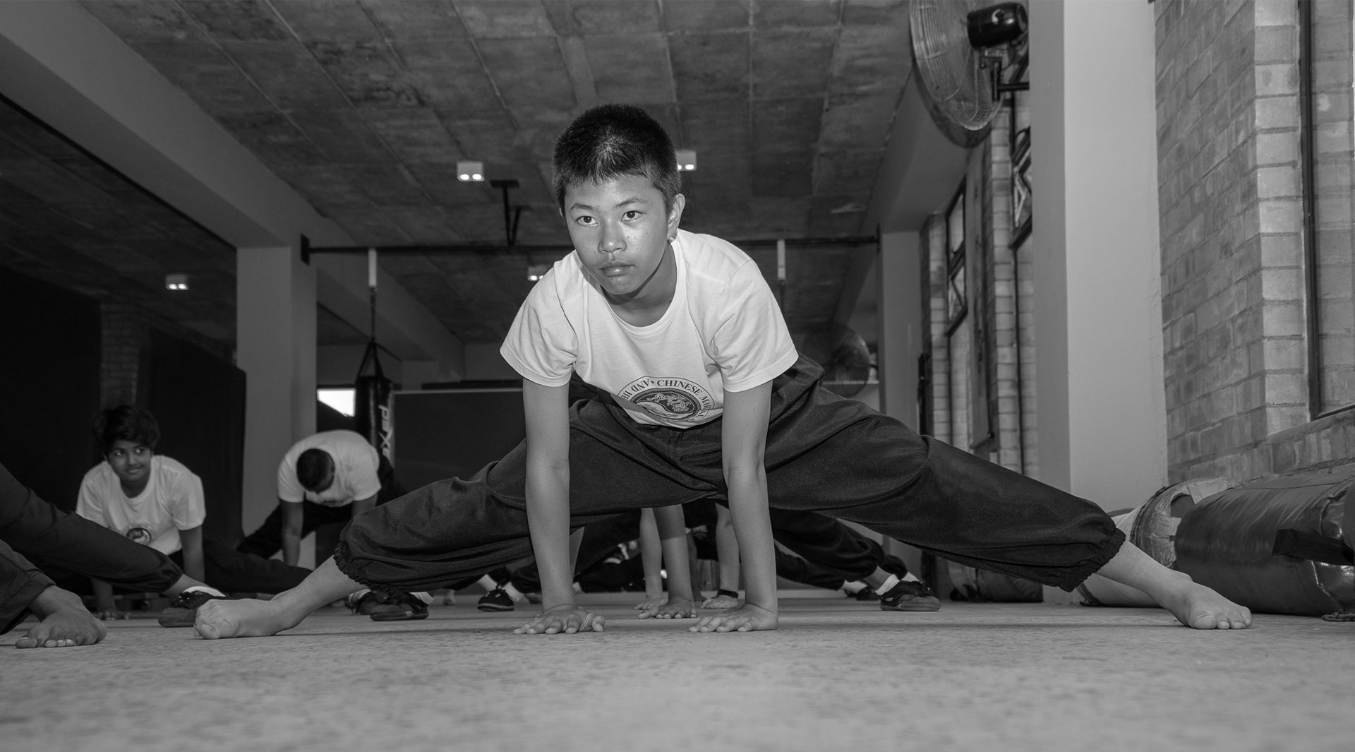 A child developing mobility in Kung Fu class